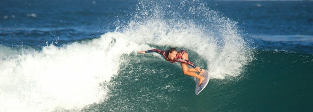 Carly Shanahan surfing