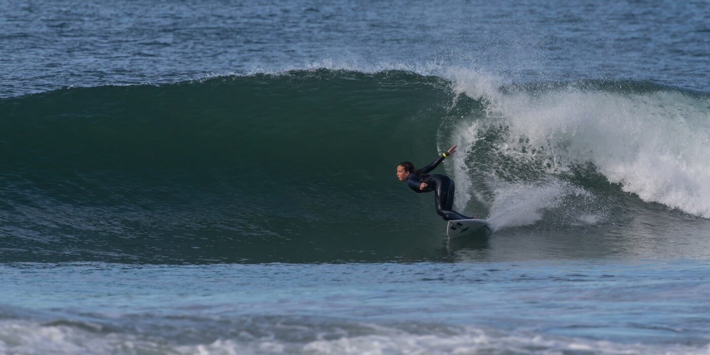 Carly carves it up surfing