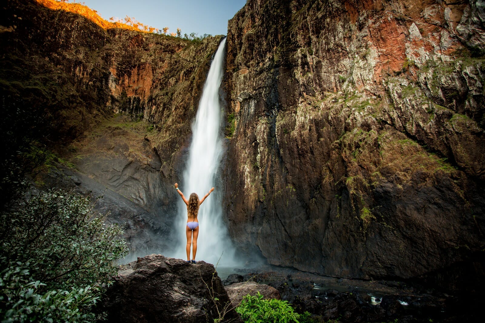 Girl in front of a waterfall
