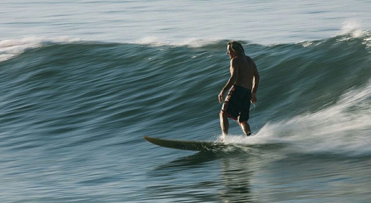 Albe riding a wave in Noosa