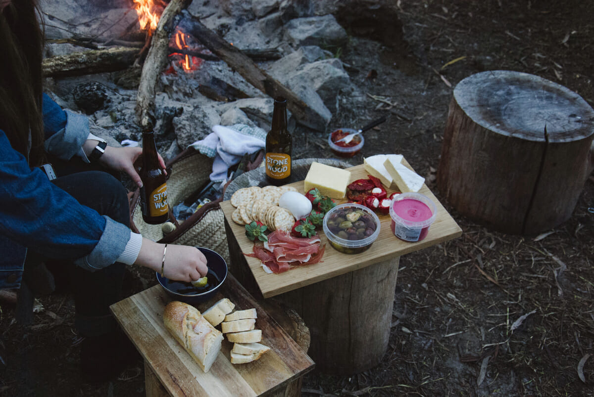Campfire with food on chopping boards