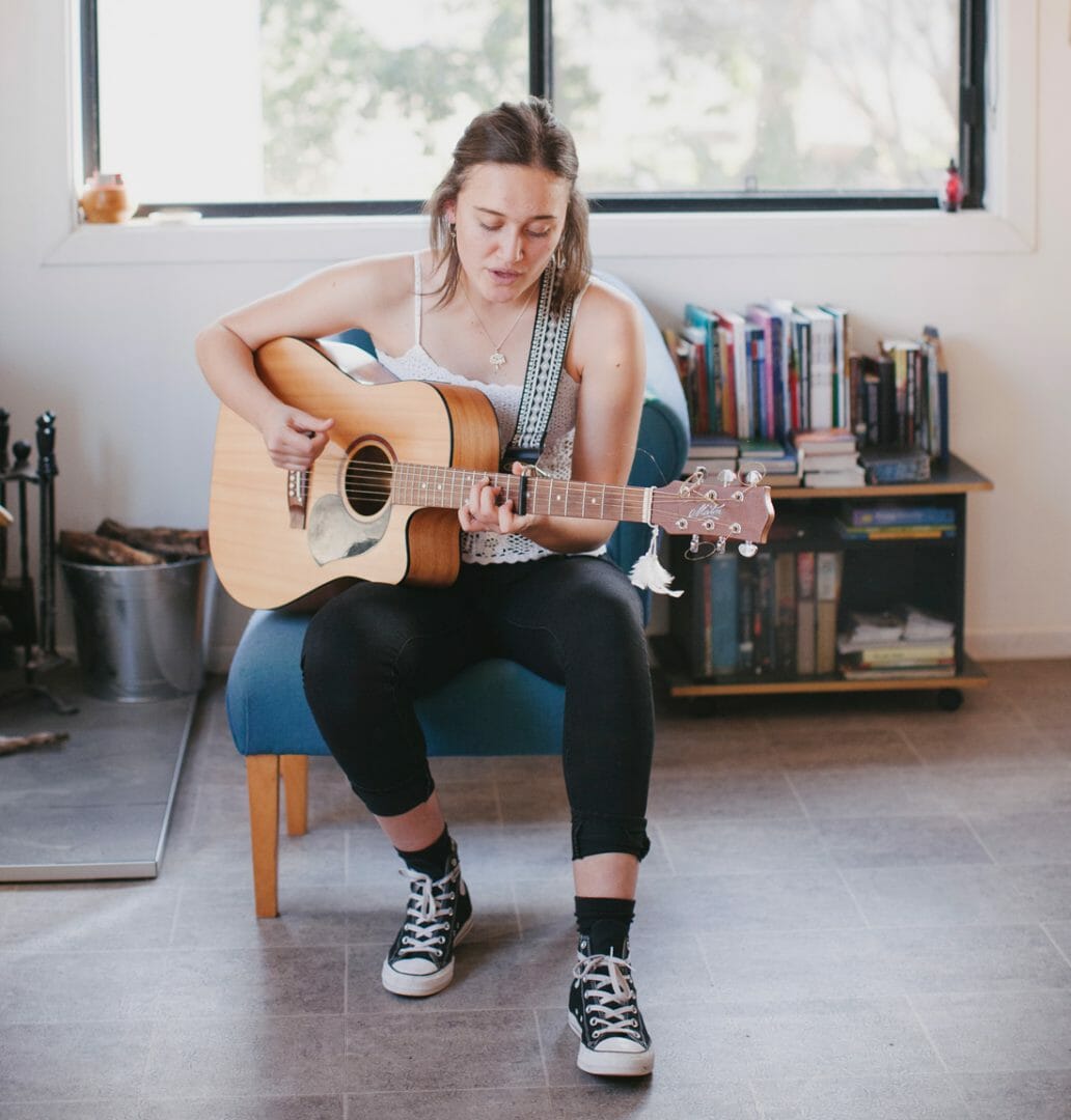 Georgia Cummins playing guitar