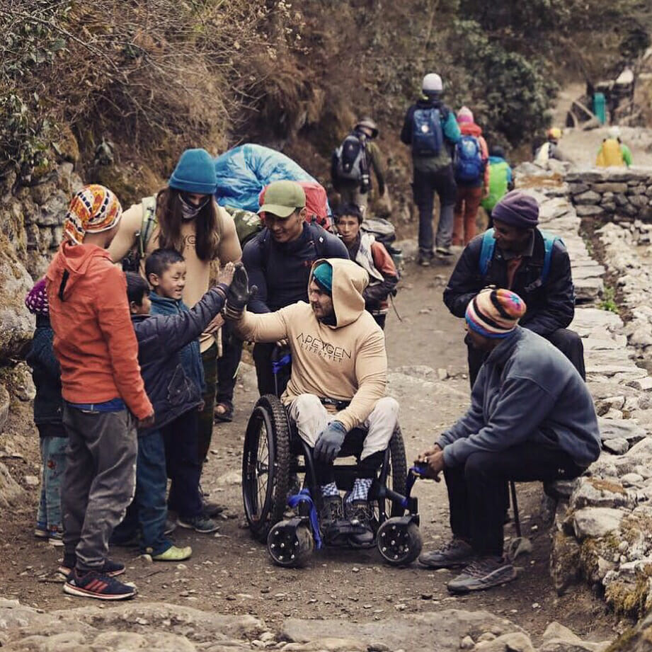 Scott greets locals on his adventure