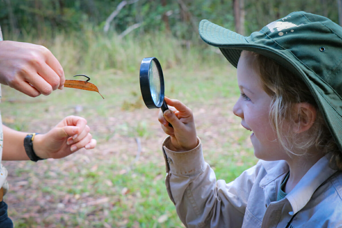 girl with magnifying glass