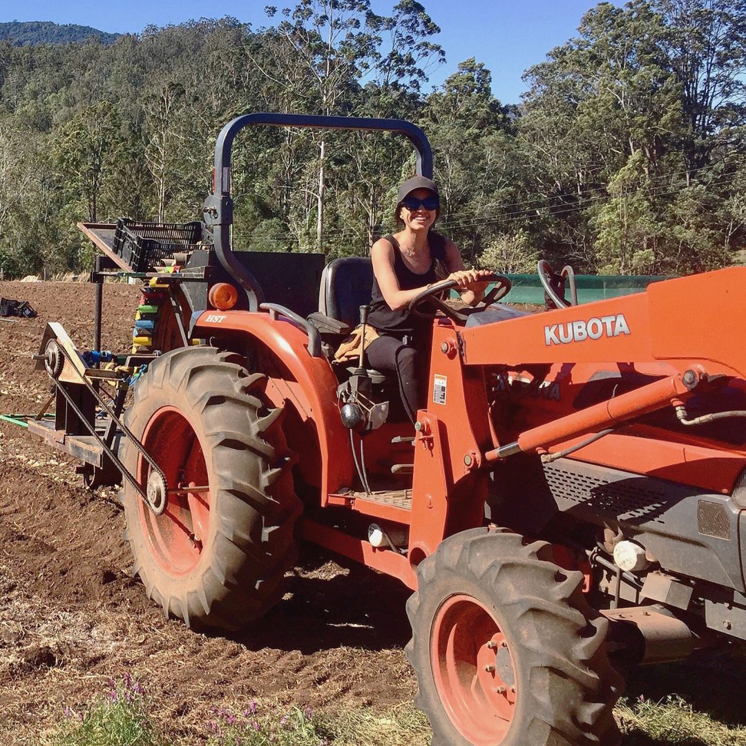 mel on a tractor