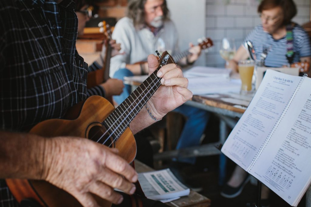 Ukelele enthusiasts embracing the Uko Ono community through their passion for music. Photo by Elize Strydom