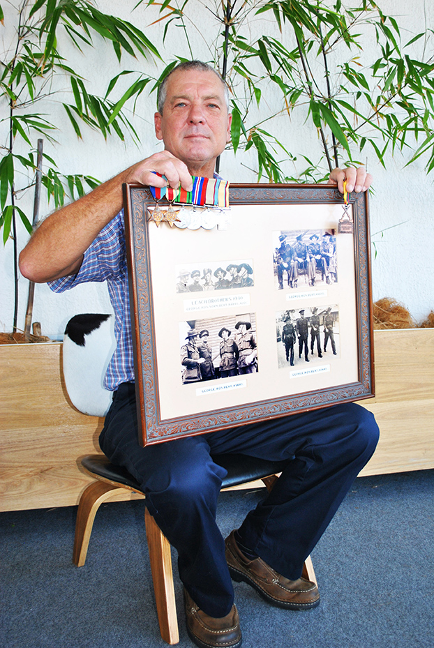 Damon Leach – Coffs Harbour City Council Member holding a photo of his Grandfather: George Leach, WWII and telling one of the many local veteran stories.
