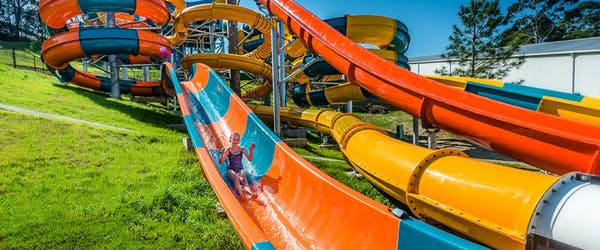 A woman on a water slide at The Big Banana. 