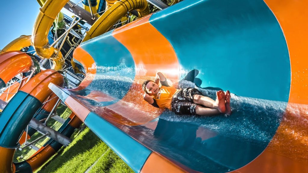 A child on a water slide at The Big Banana