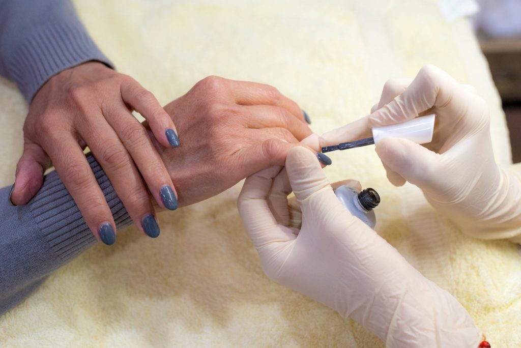 Close up of nails being painted