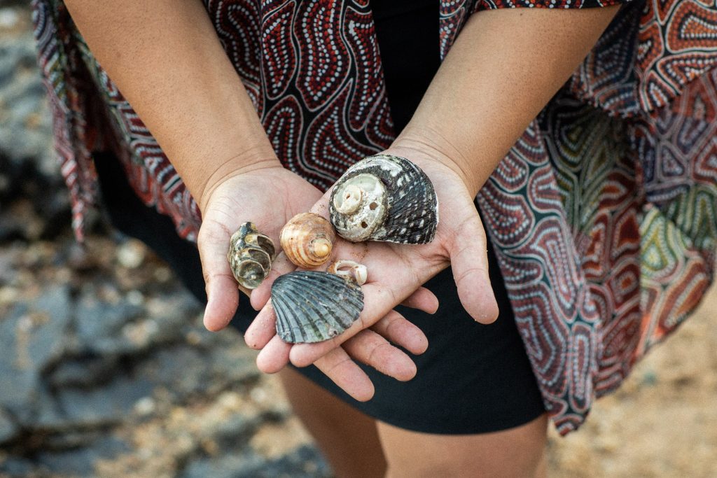 Close up of Rhiannon Mitchell holding sea shells