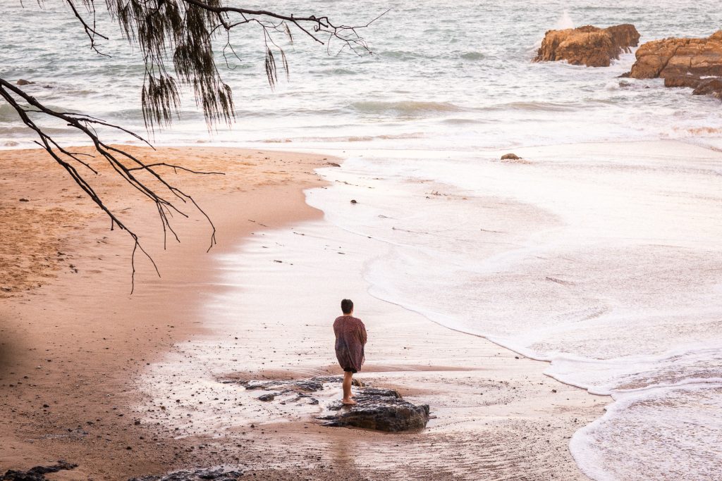 Rhiannon Mitchell on a Coffs Coast beach at dusk 