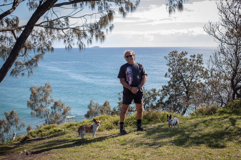Vince Espaze and his two small dogs on the headland at Sapphire Beach 
