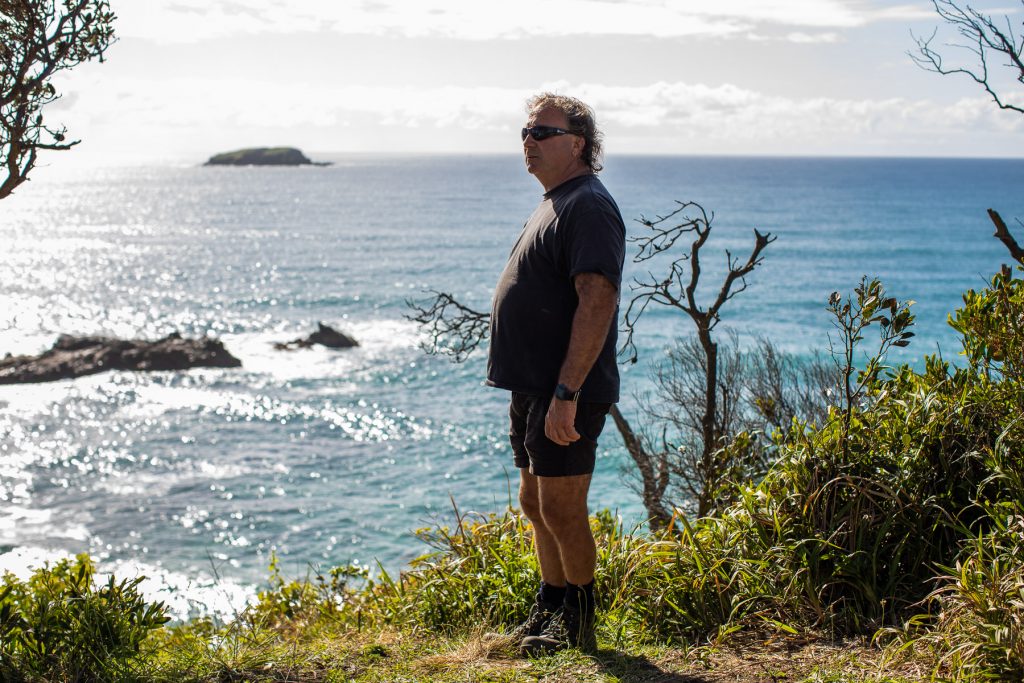 Vince Espaze looking out at the ocean from Sapphire Beach headland