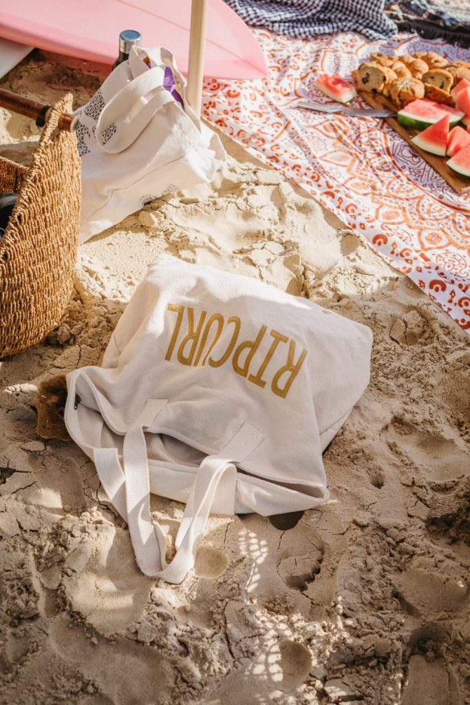 White Rip Curl tote bag on the sand at the beach 