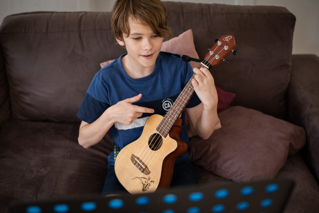 Mis shot of Keiran Porter playing ukulele