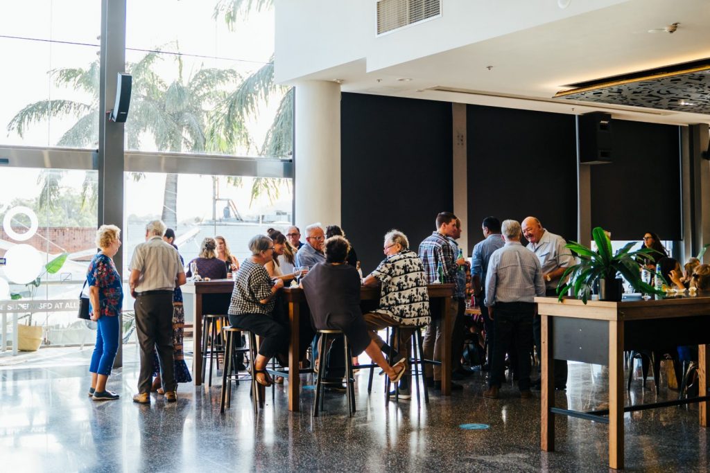 Wide shot of people sitting in a restaurant 