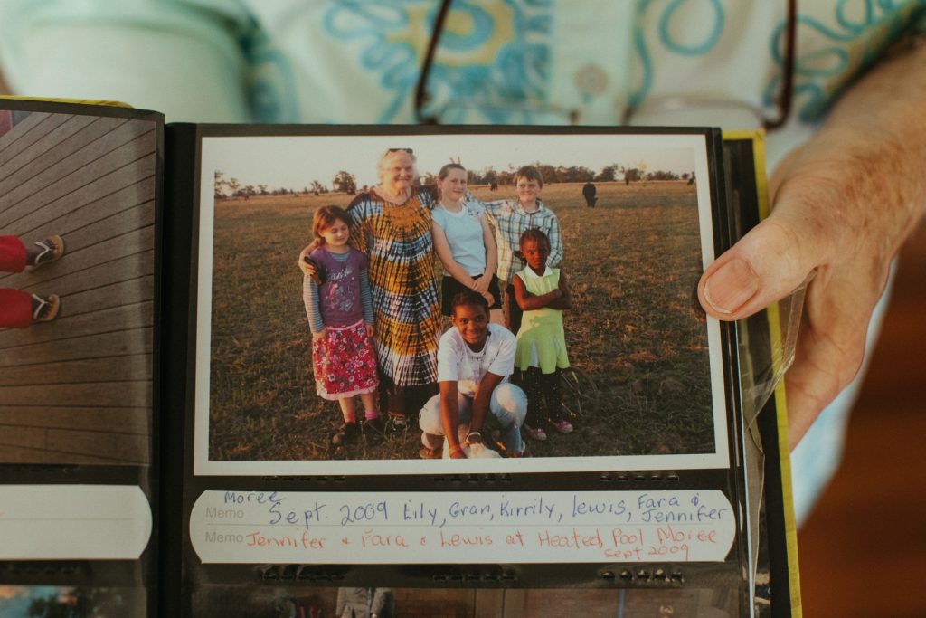 A close up of a photo of children in a photo album. 