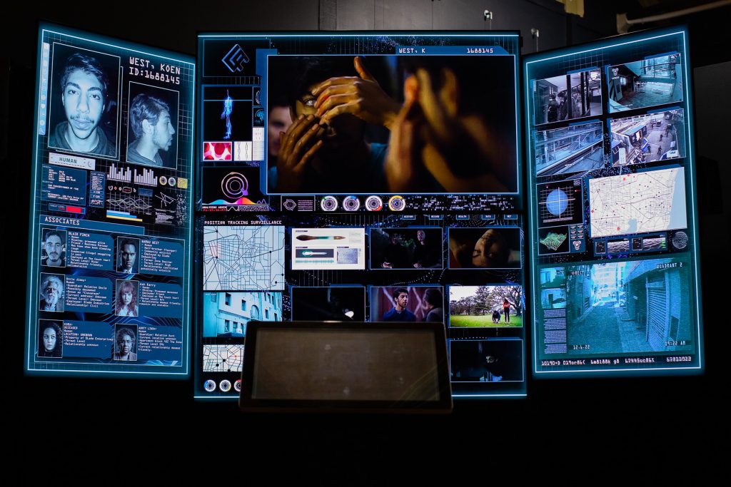A digital screen with images, text and videos from Cleverman
