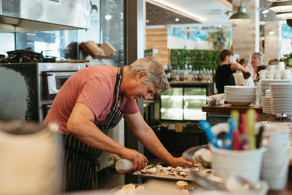 A candid shot of a chef preparing food