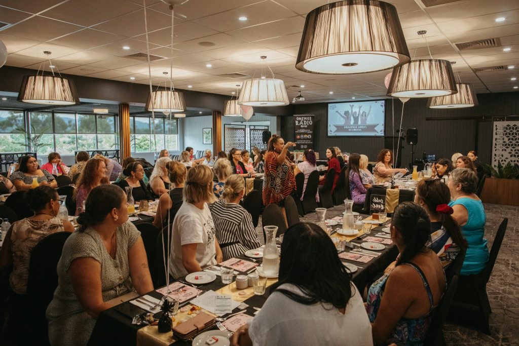 Wide shot of women attending an International Women's Day lunch
