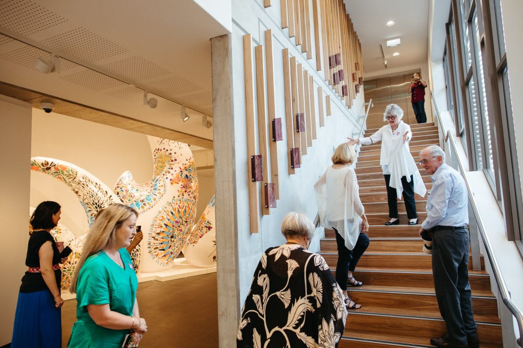 A small group of people in an art gallery 