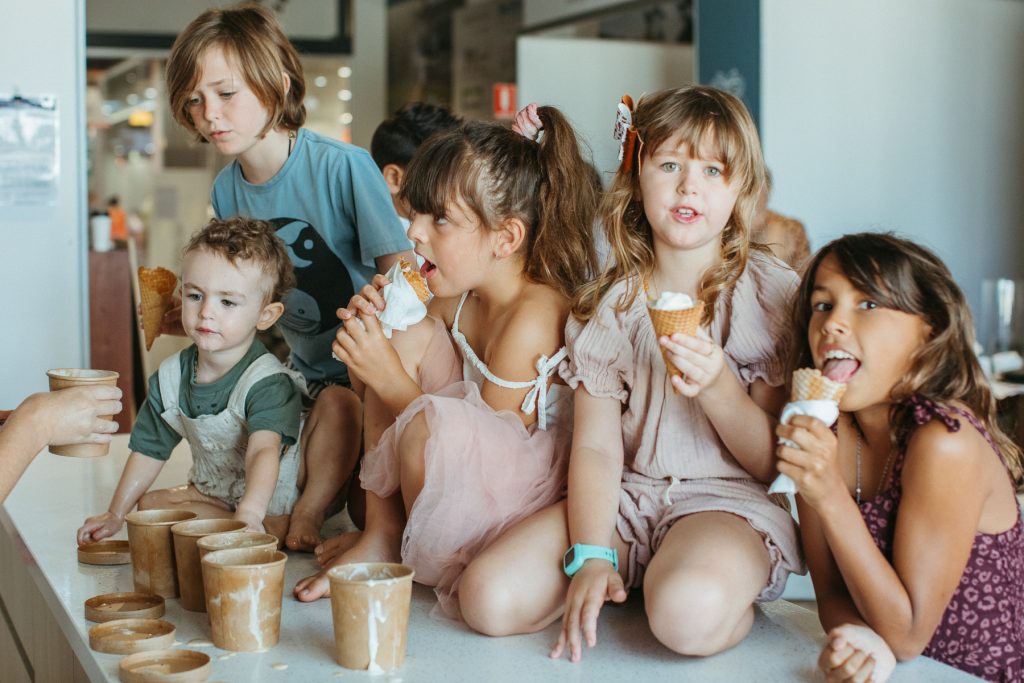 A group of young children eating gelato