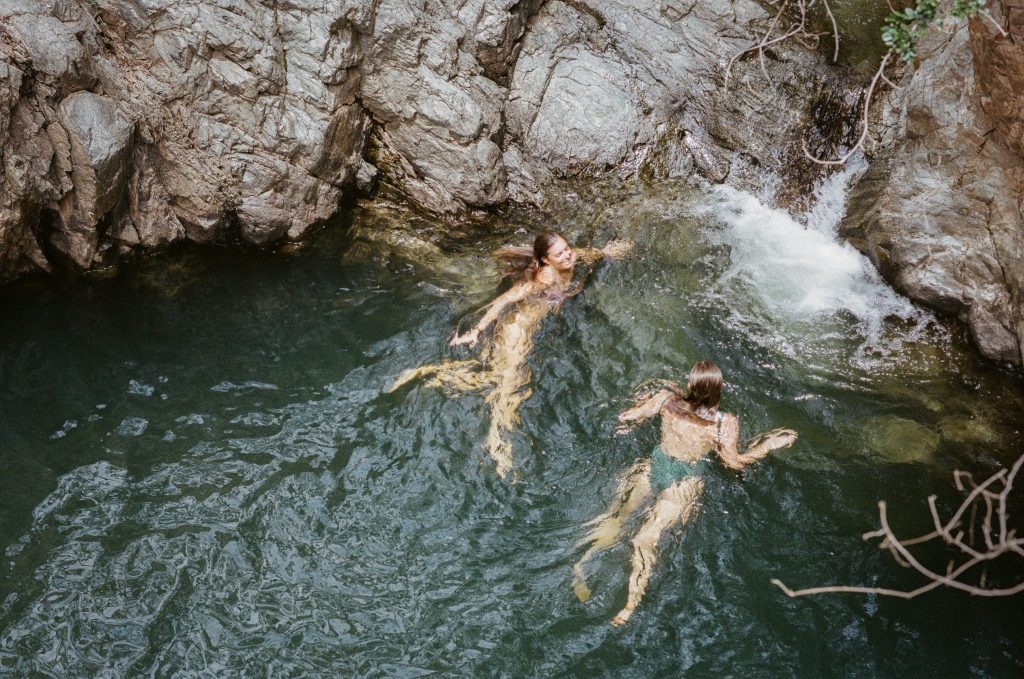 Top down shot of two women in a wild waterhole