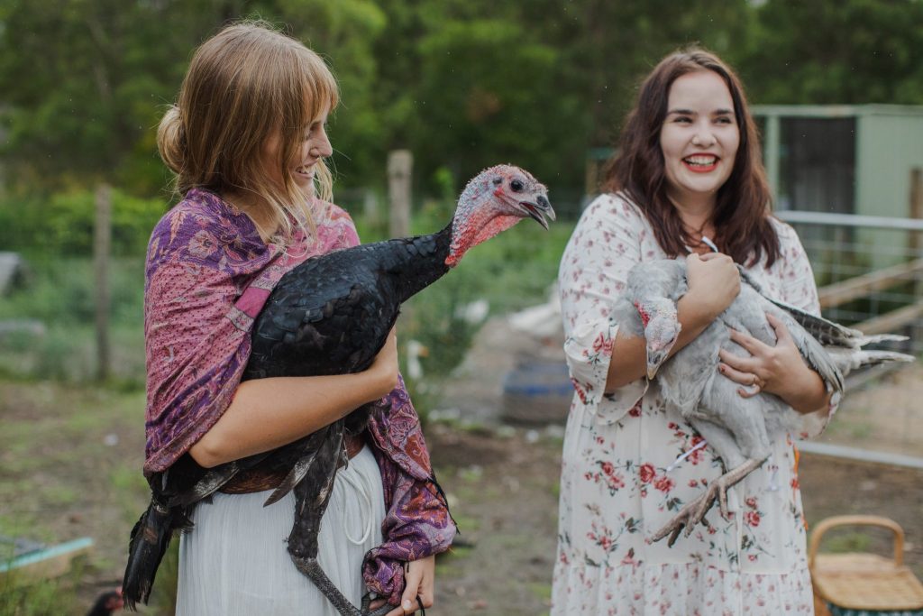 Young woman holding a turkey