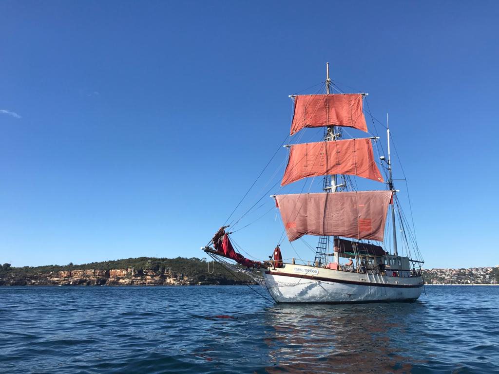 A wooden tall ship sailing on the ocean 