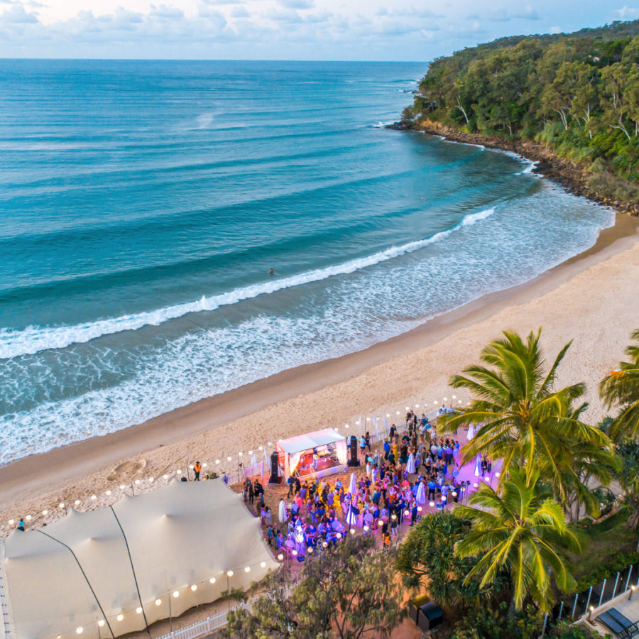Aerial photos of Noosa main beach while a party takes places on the sand