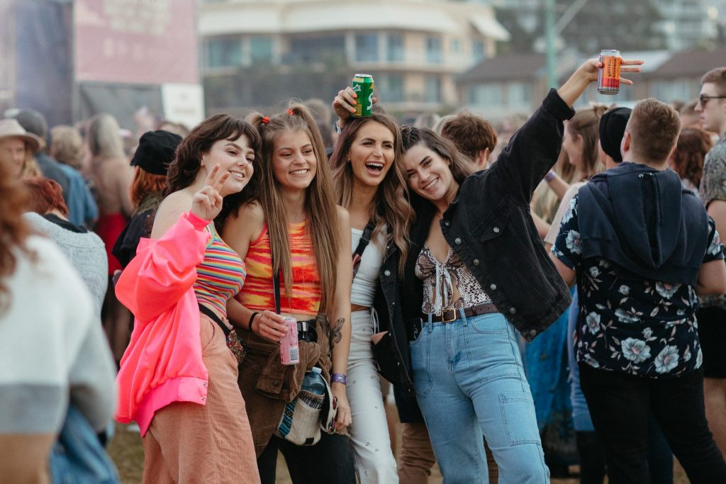 Four young people gathered together at a music festival