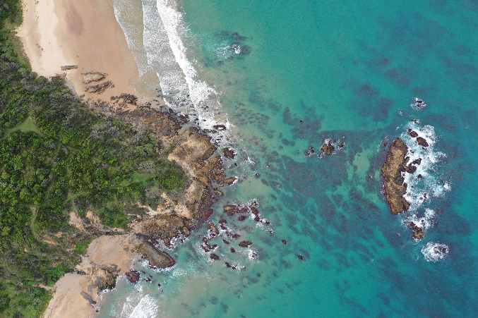 Aerial shot of an ocean and rocks 